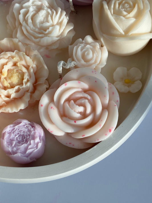 Candle with flowers in a plaster container